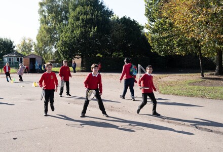 Alban Wood pupils playing tennis outside