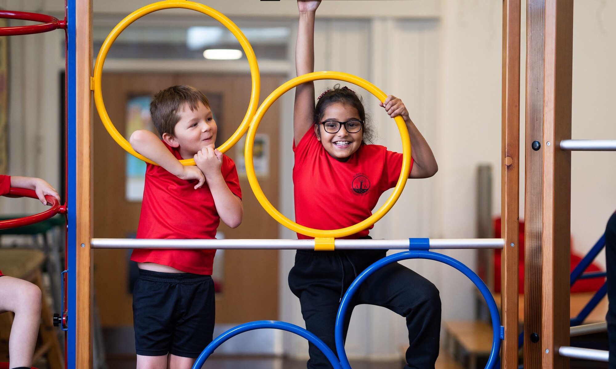 Alban Wood Infant pupils playing on climbing PE equipment