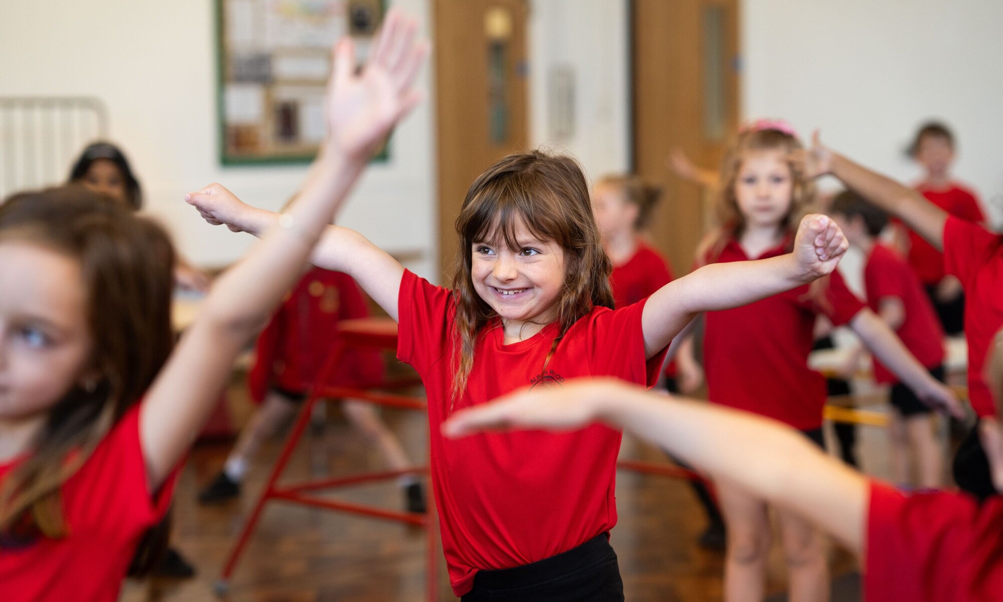 Alban Wood Infant pupils doing indoor PE