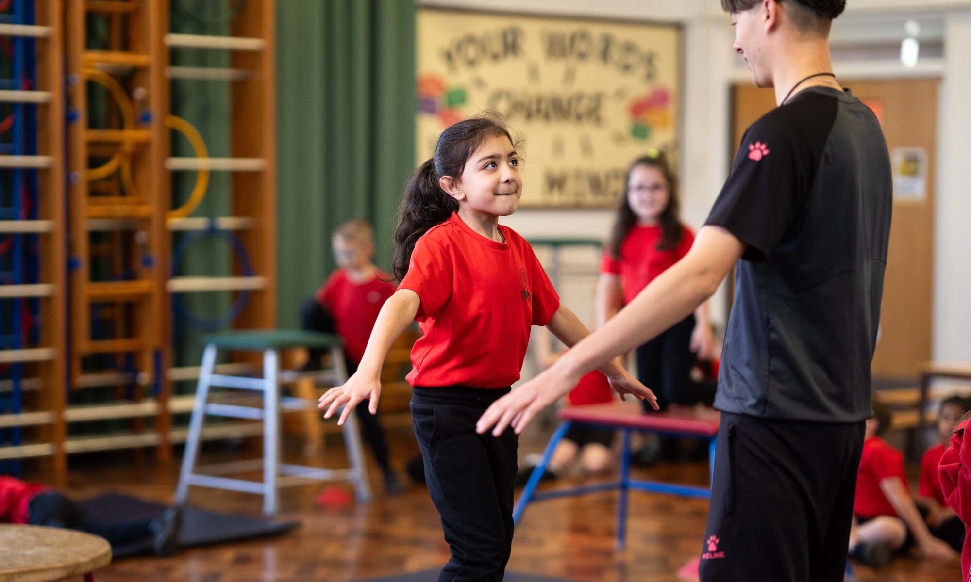 Alban Wood Infant pupils doing PE with teacher