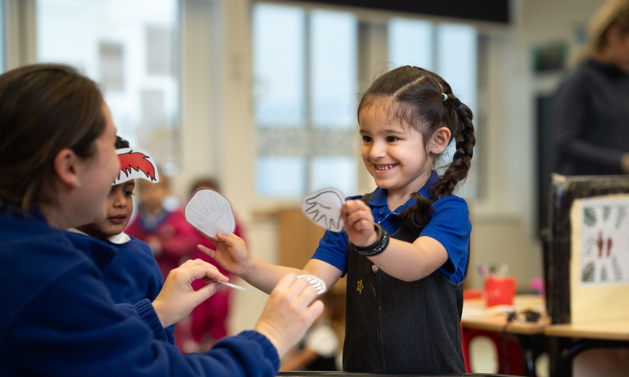 Warren Dell Primary School teacher helping a pupil