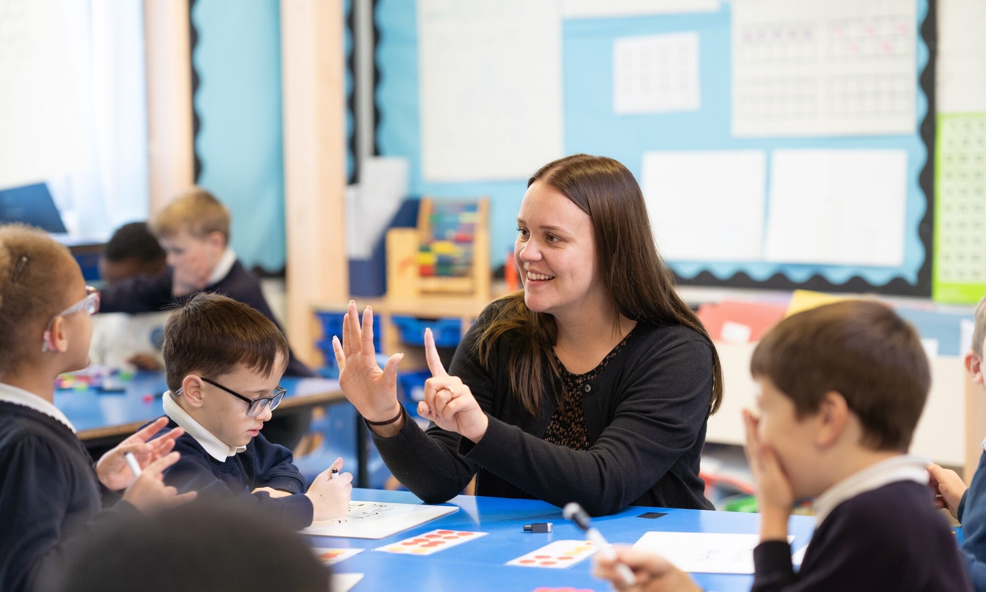 Teacher engaging with students to enhance learning experience