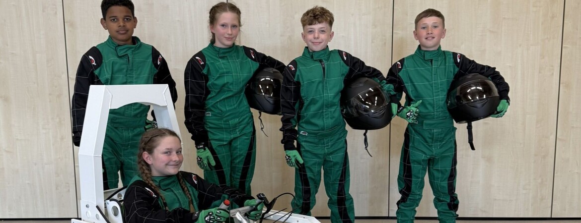 Primary pupils race their own ‘green power’ car on the Lotus test circuit