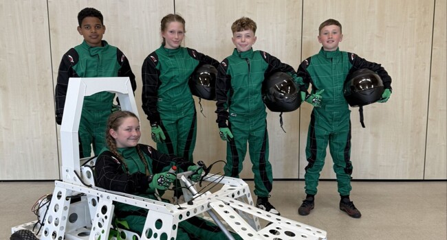 Primary pupils race their own ‘green power’ car on the Lotus test circuit Image