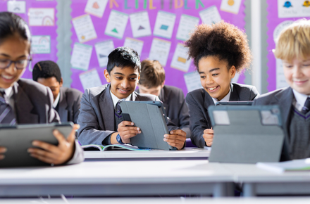 Students on ipads in a classroom