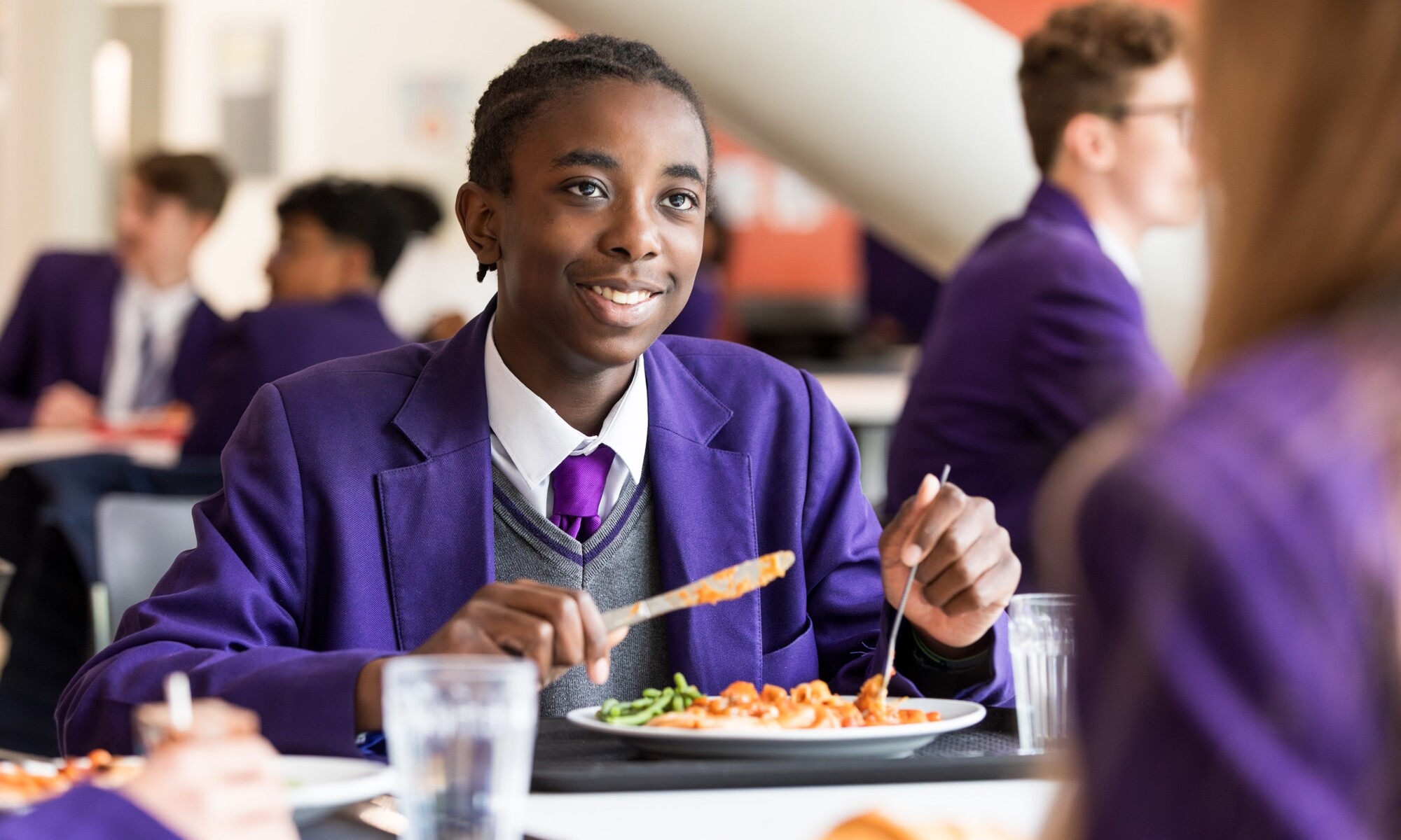 The Bridge Academy pupil having lunch in the canteen