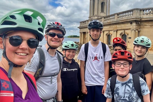 Enrichment: Students and Teachers pose for a photo after bike riding