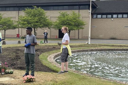 Enrichment: Students and Teachers work together around the Brooke Weston fountain to create a beautiful garden