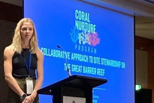 Alumni paige at a conference