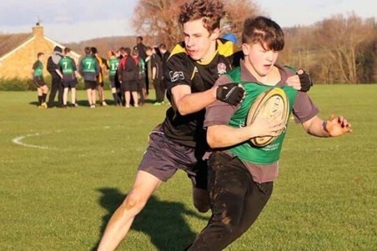 Students playing rugby