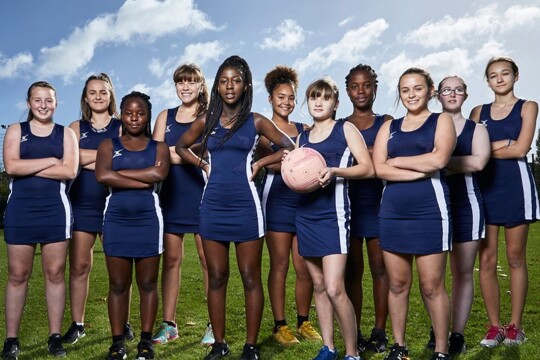 Posed photo of female students in pe kit