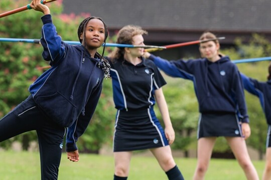 Students participating in javelin