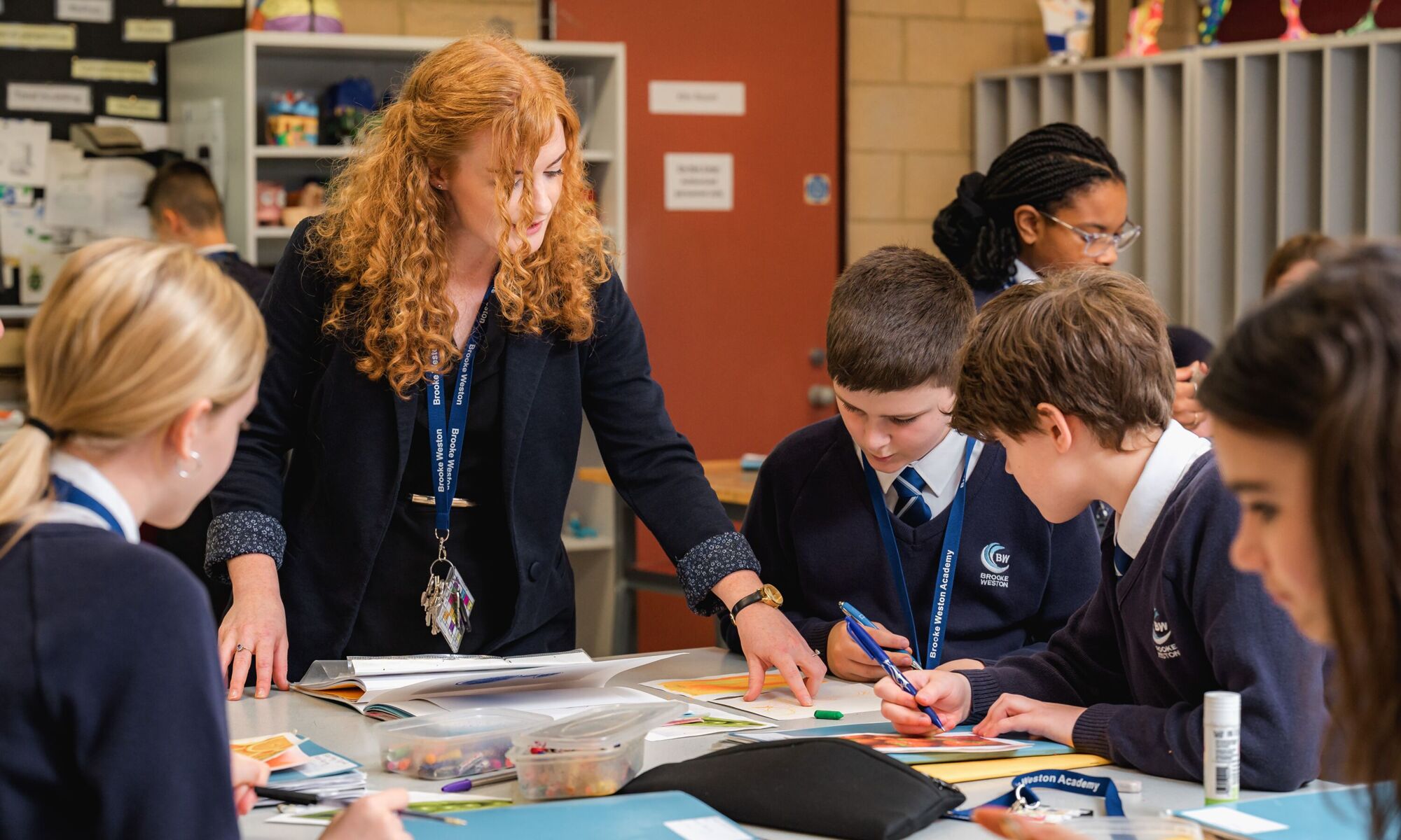 Brooke Weston Trust teacher helping pupils
