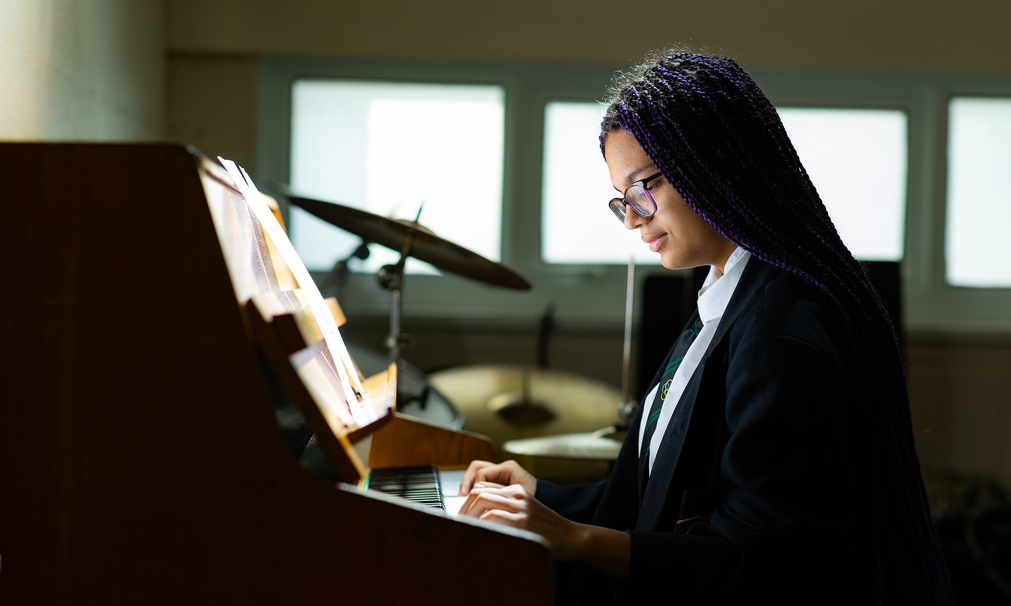 Cove School image of student playing piano