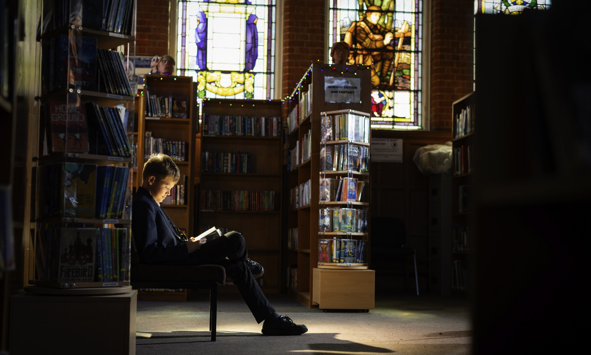 Hitchin Boys' School pupil in the library