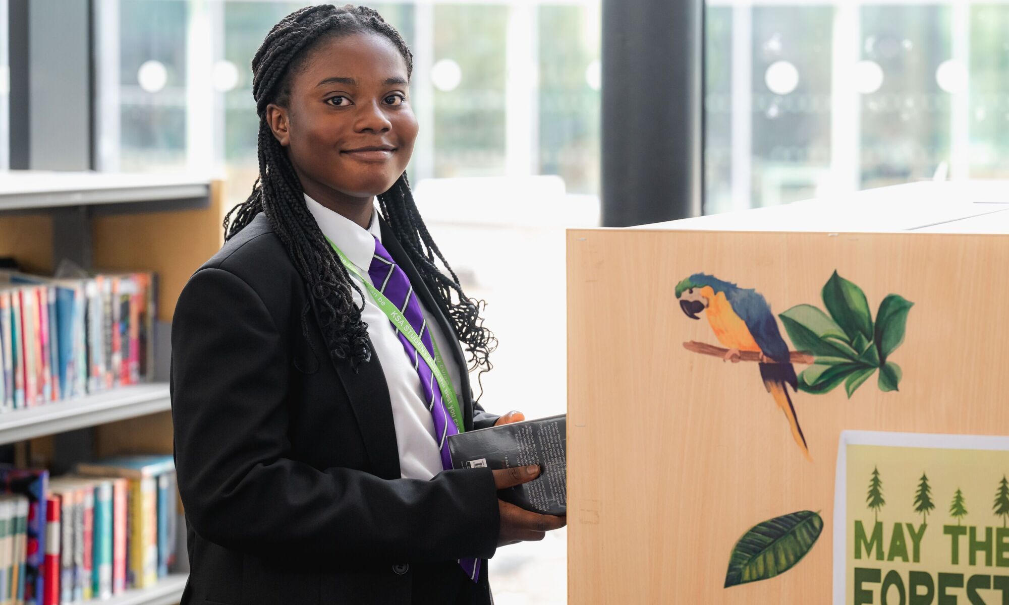 Kettering Science Academy - student with book in library