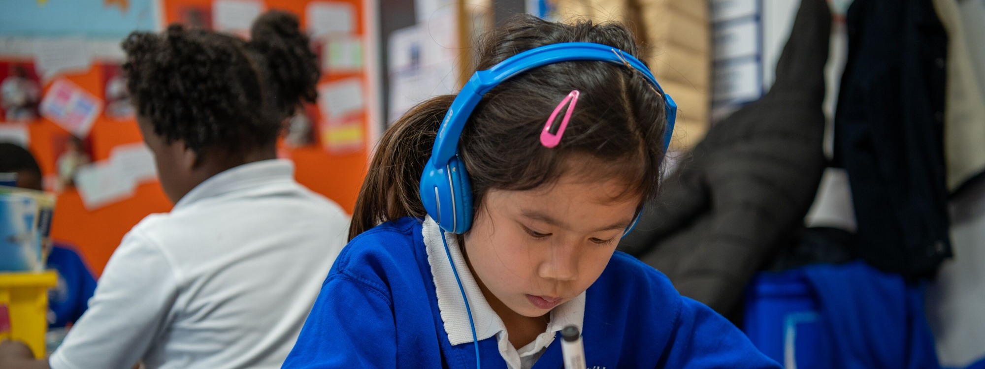 Childeric Primary School Student Listening to Music