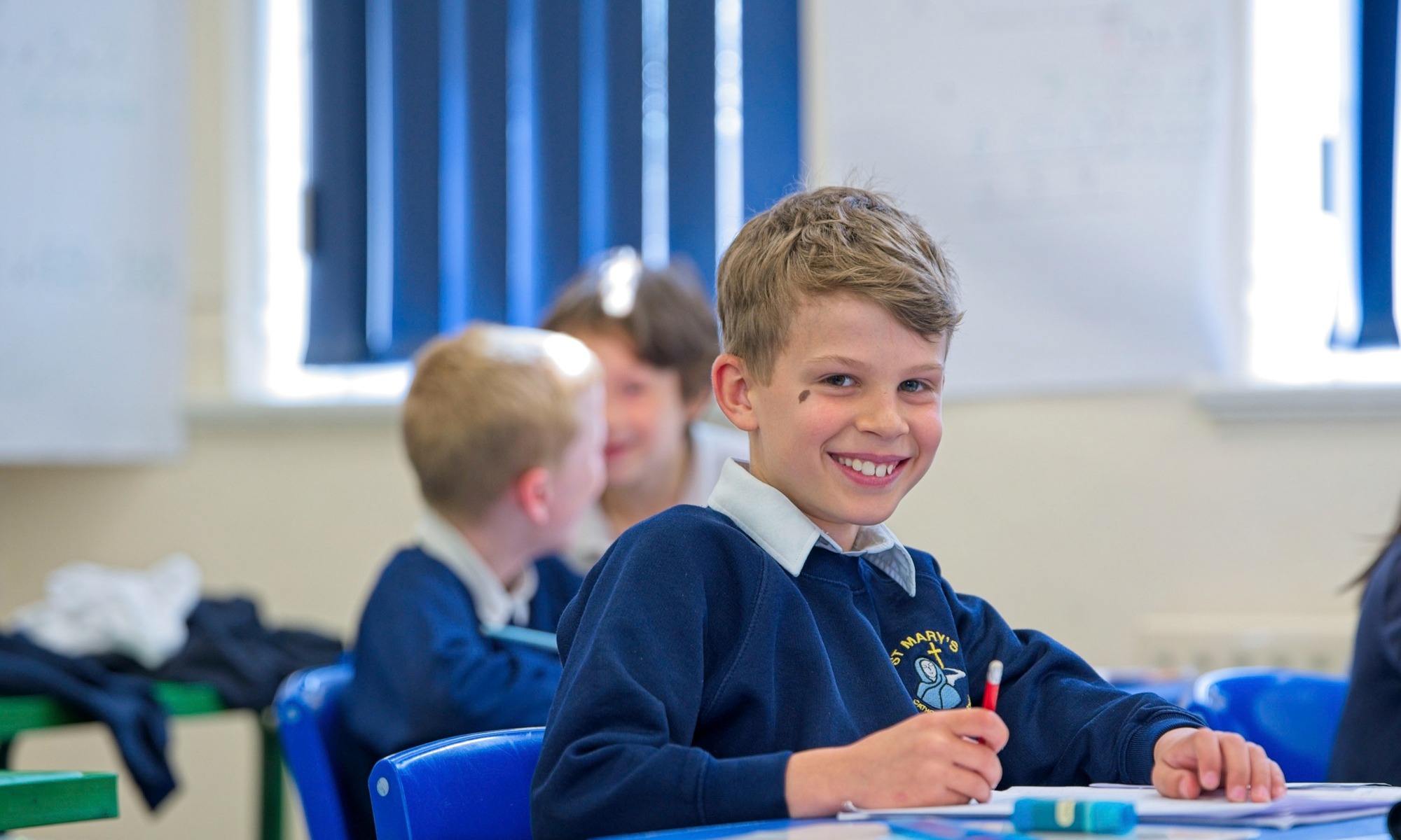 St Mary's Catholic Primary pupil in lesson