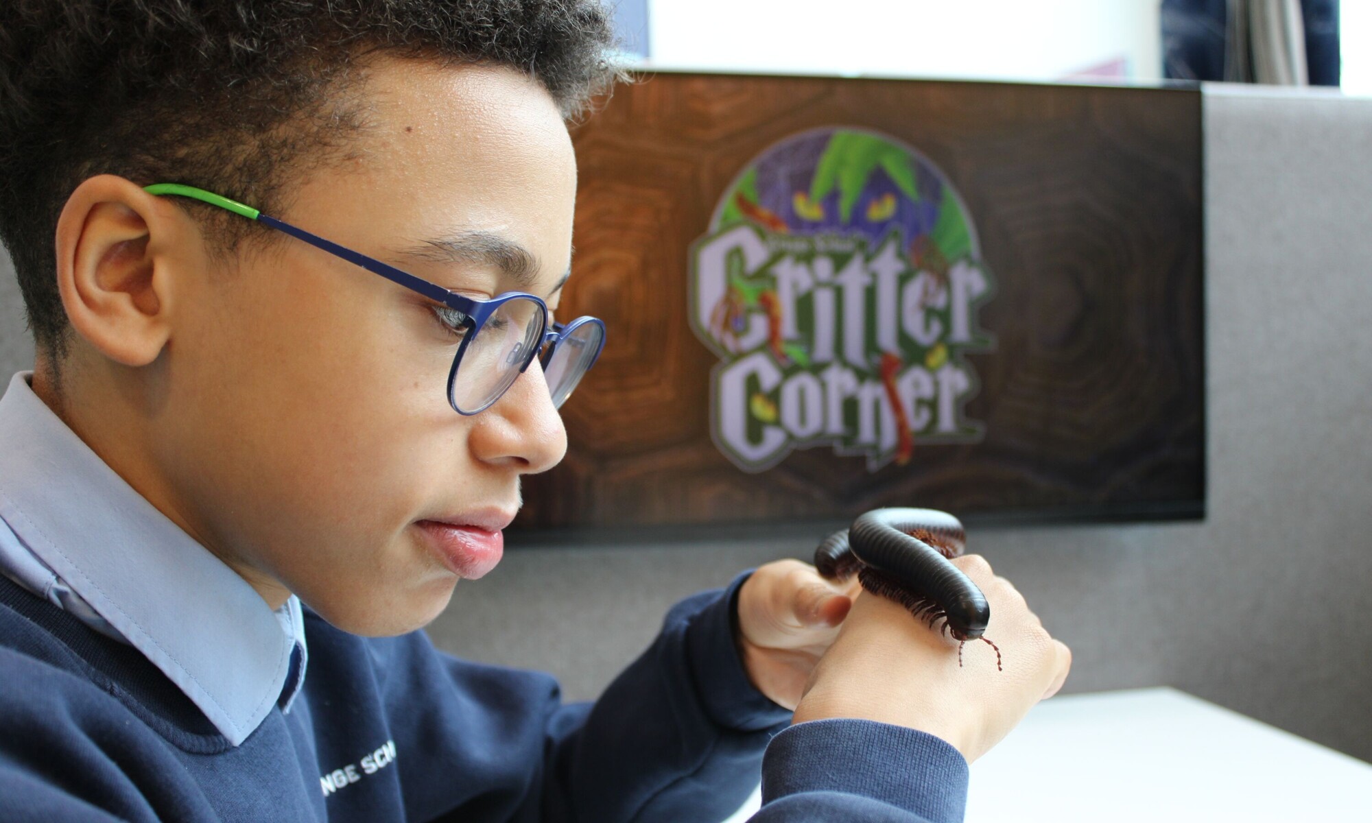 Orchard House High School pupils holding an insect