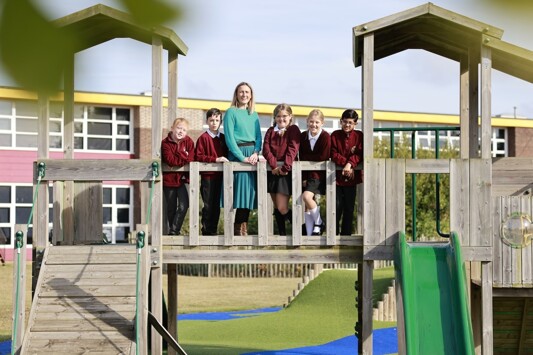 Alton Park headteacher and pupils outside on climbing frame