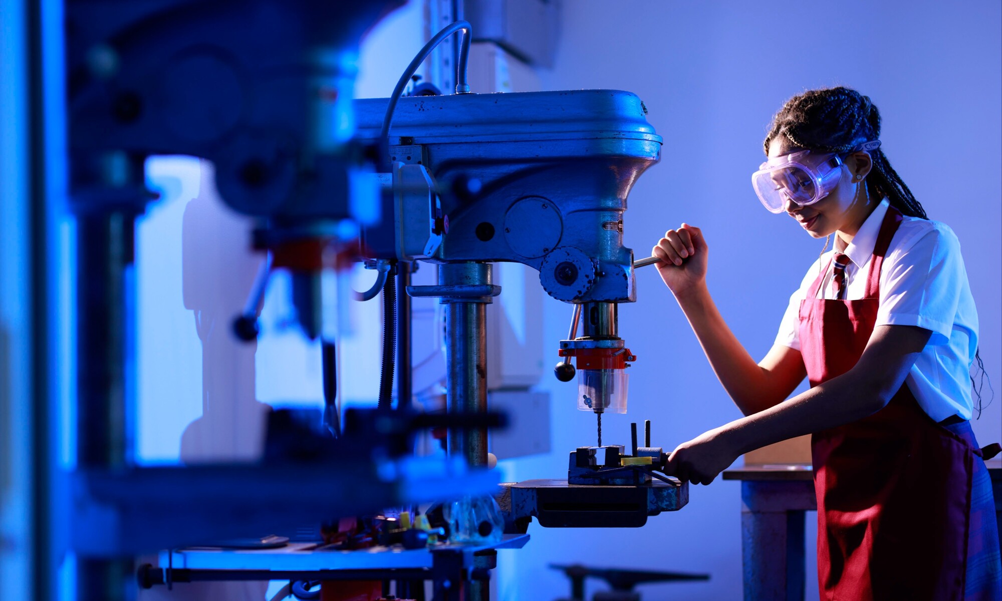 Student using a pillar drill in DT Class