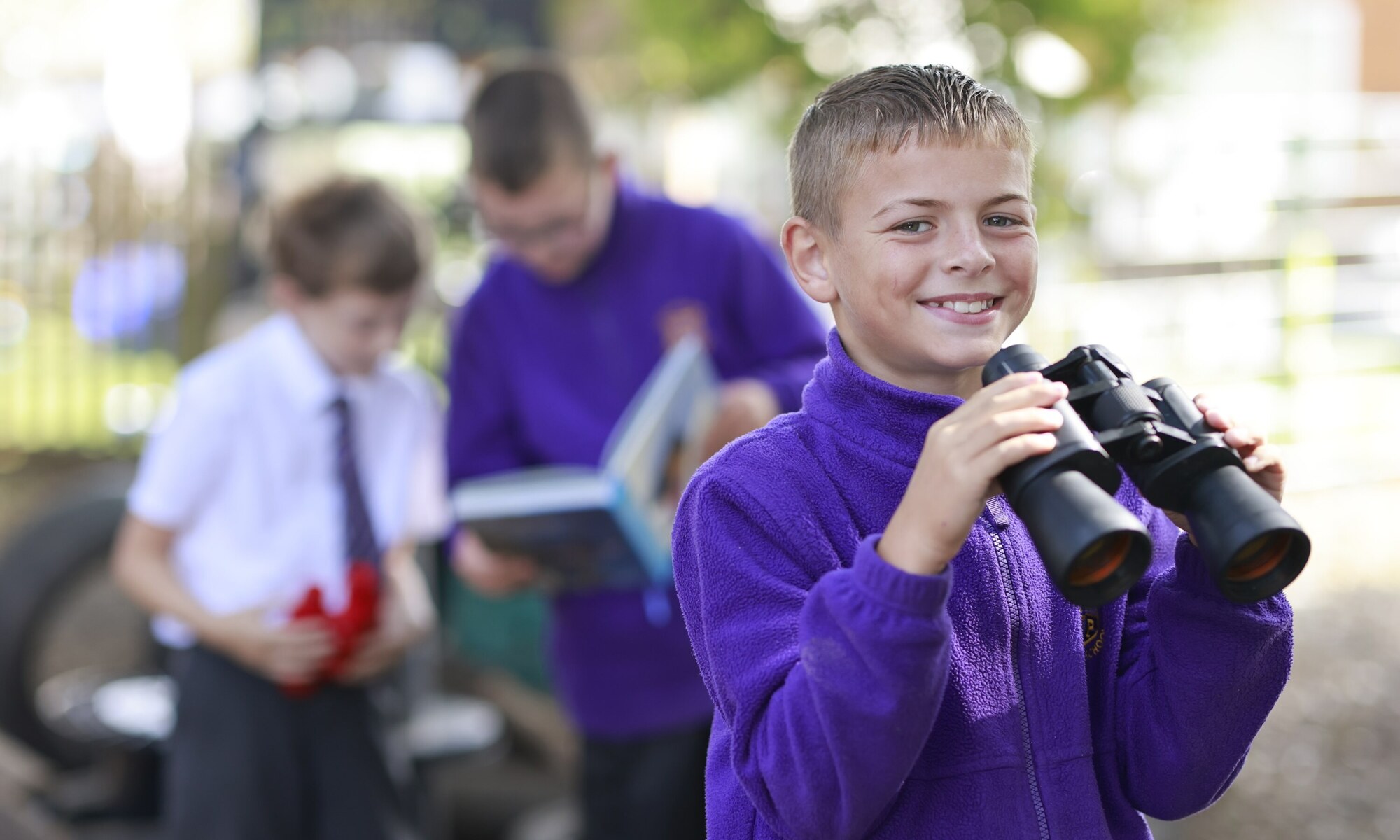 Holland Park Primary School - Pupil with binoculars