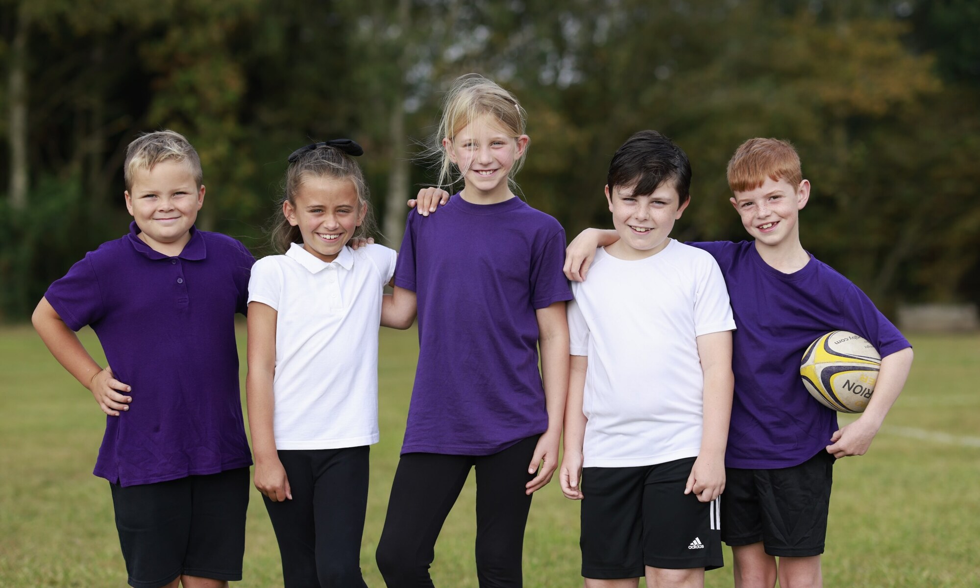 Holland Park Primary School - 5 pupils with a football