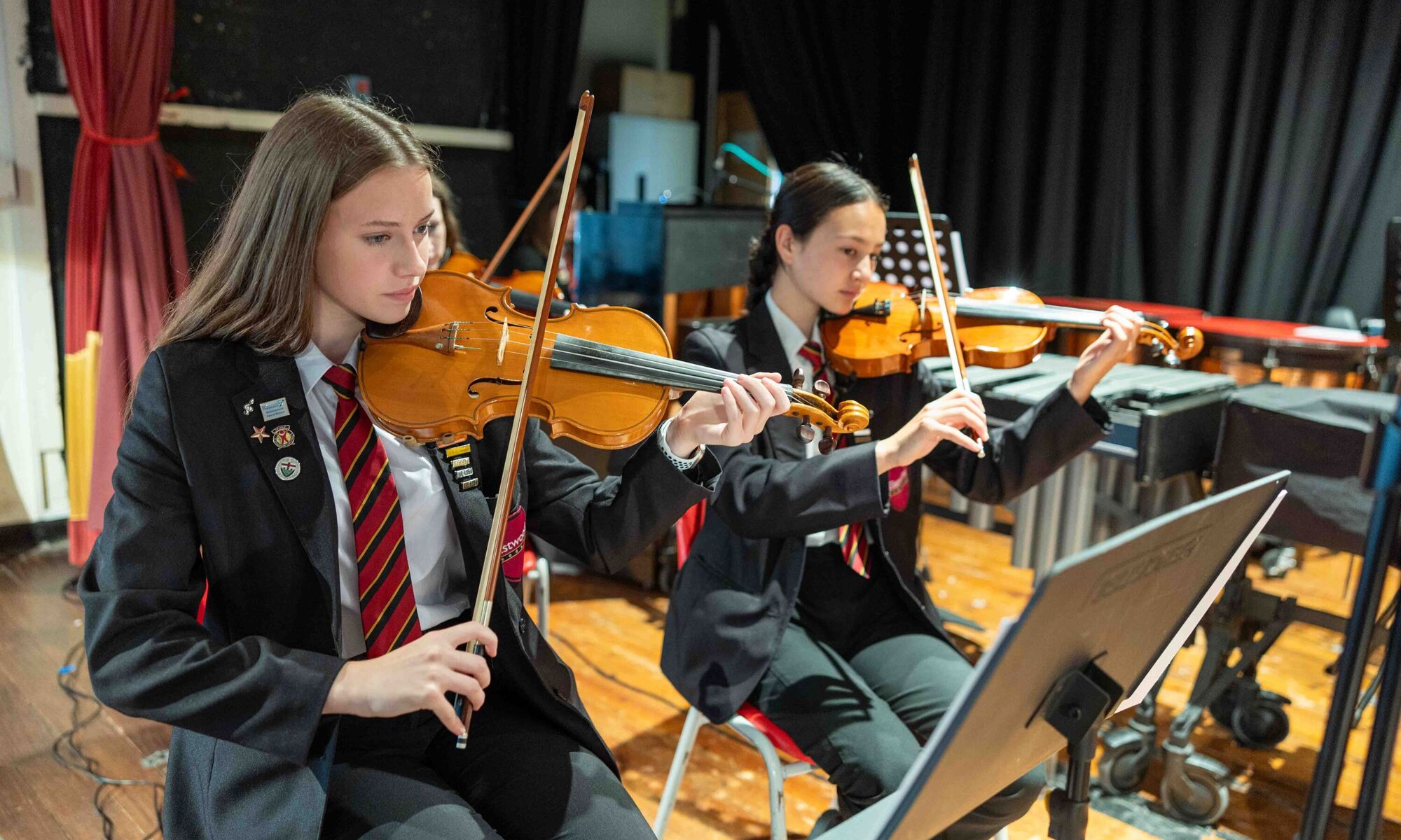 The eastwood academy students playing the violin